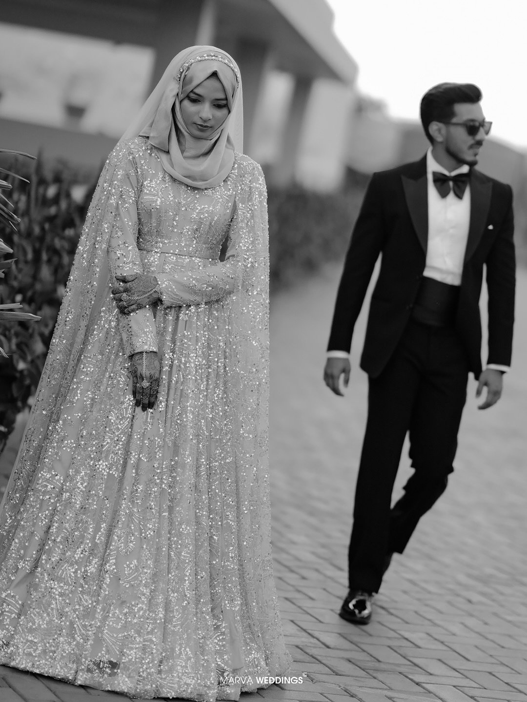 Bride and groom in a black-and-white editorial portrait